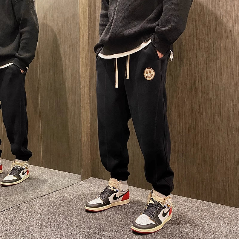 Cozy sweatpants with embroidered smileys